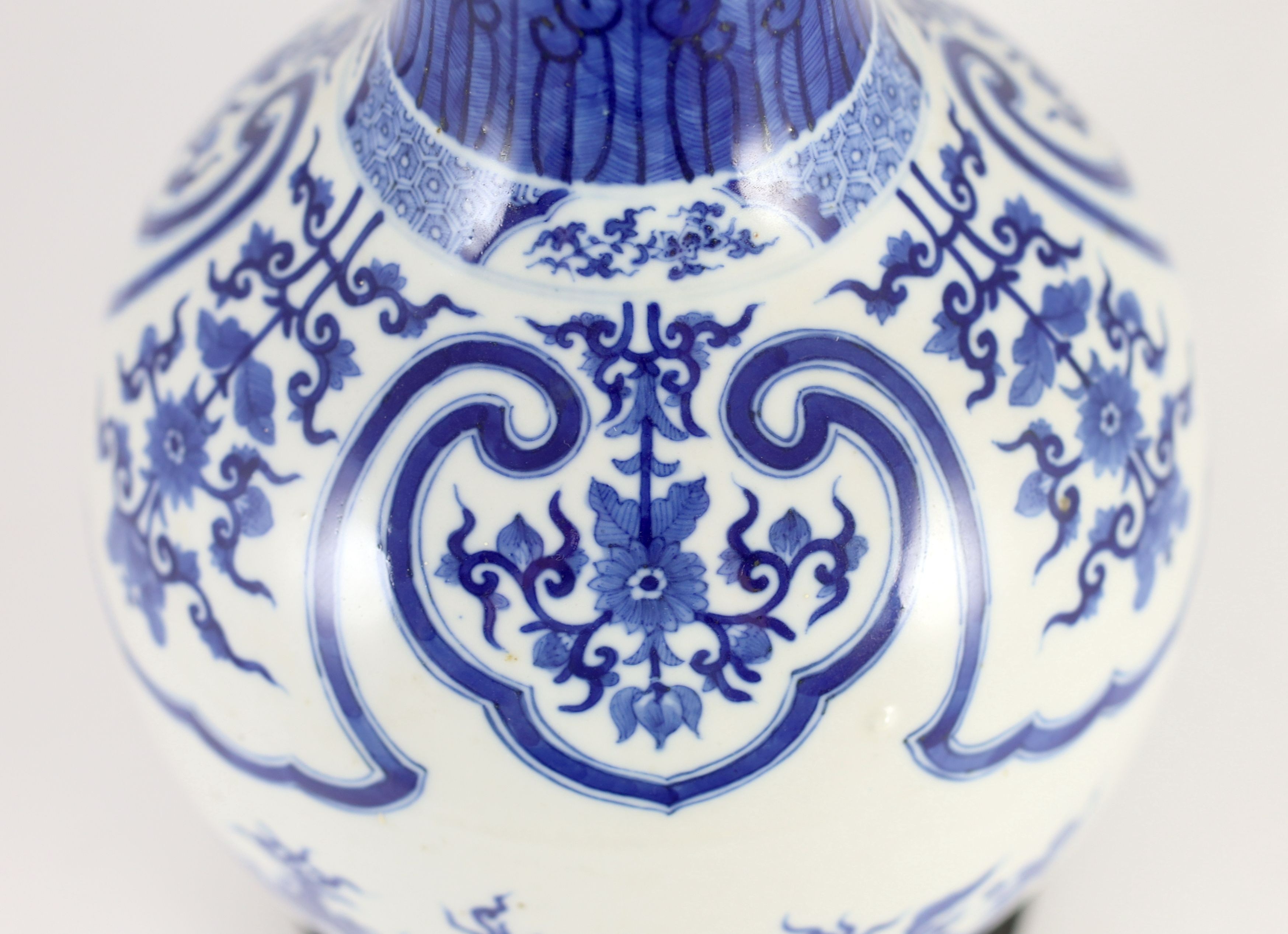 A large Chinese blue and white bottle vase, 19th century, 46cm high, wood stand, drilled hole to vase